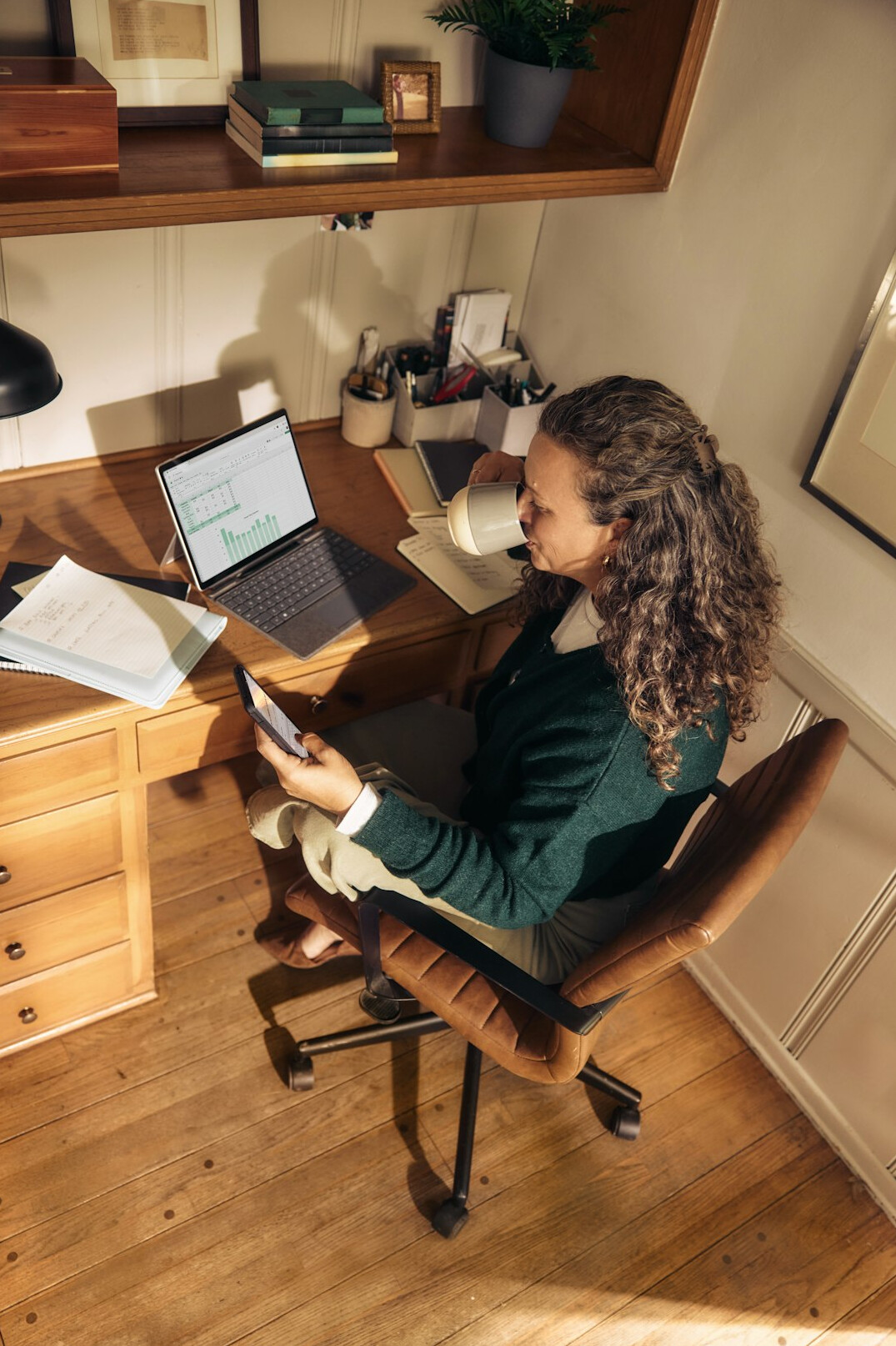 woman writing mystery novel at desk